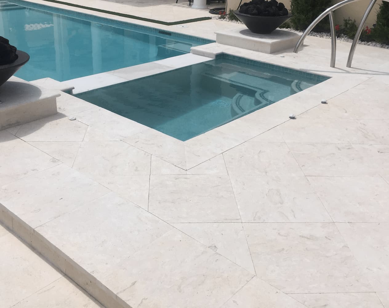 Coral Reef White brushed 24x24 tiles with 12x24 coping